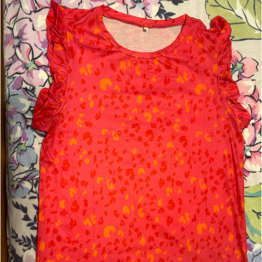 Brand new fun animal print top with ruffle sleeves.
